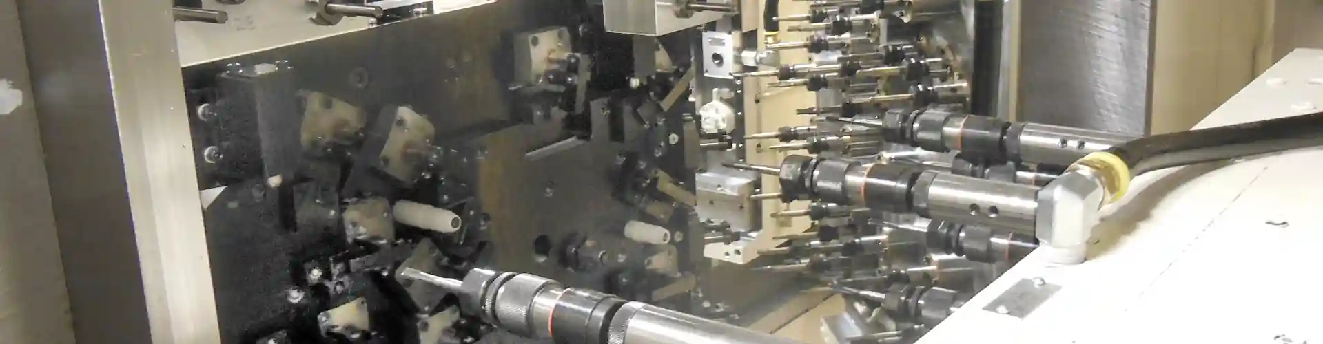 Complex machining setup with multiple tools representing custom machine solutions.