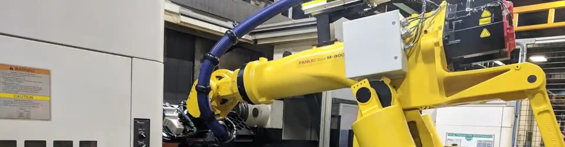 Robotic arm in an industrial setting representing robotic automation capabilities.