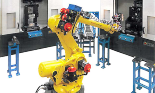 "Robotic arm in a manufacturing setting with machinery and transfer carts. Case Study